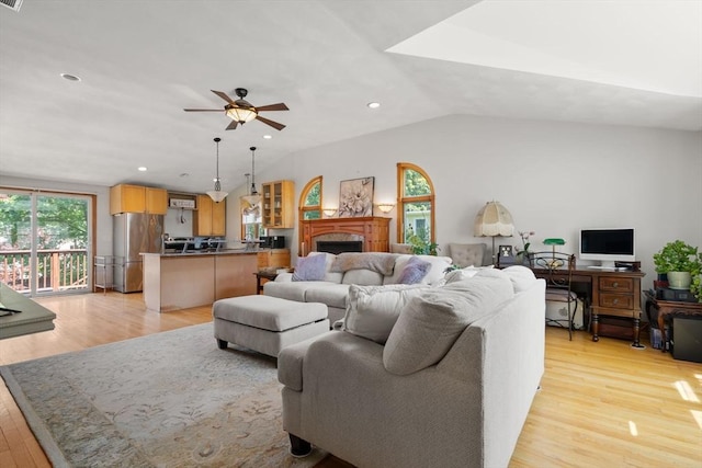 23 Hanson St, Wakefield, MA 01880 - living area featuring light wood finished floors, a ceiling fan, a fireplace, vaulted ceiling, and recessed lighting
