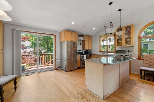 23 Hanson St, Wakefield, MA 01880 - kitchen featuring appliances with stainless steel finishes, a peninsula, light wood-style floors, stone counters, and recessed lighting