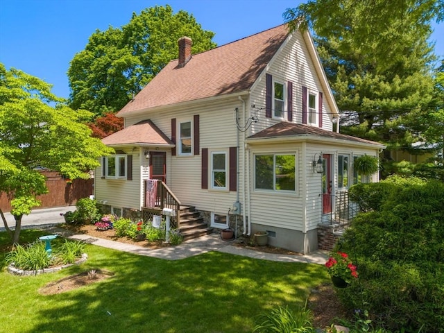 23 Hanson St, Wakefield, MA 01880 - view of front of house with a chimney and roof with shingles