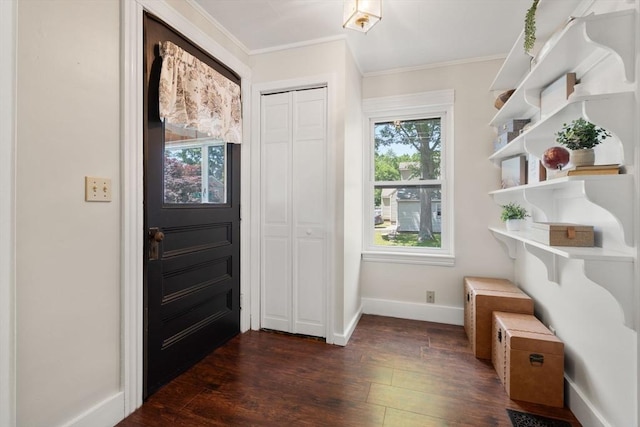 23 Hanson St, Wakefield, MA 01880 - entryway with crown molding, baseboards, and dark wood finished floors