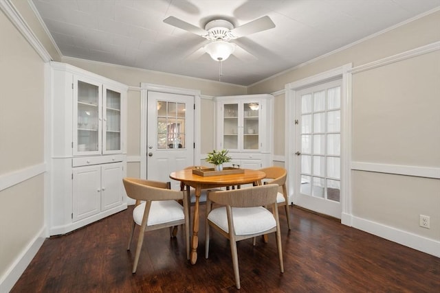 23 Hanson St, Wakefield, MA 01880 - dining space with dark wood-style flooring, baseboards, ceiling fan, and crown molding