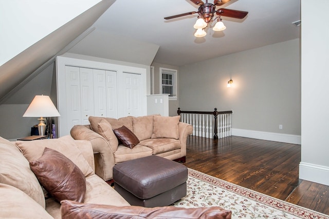 living room featuring dark hardwood / wood-style floors and ceiling fan