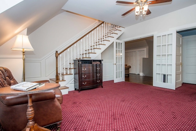 sitting room featuring carpet flooring, french doors, ceiling fan, and lofted ceiling