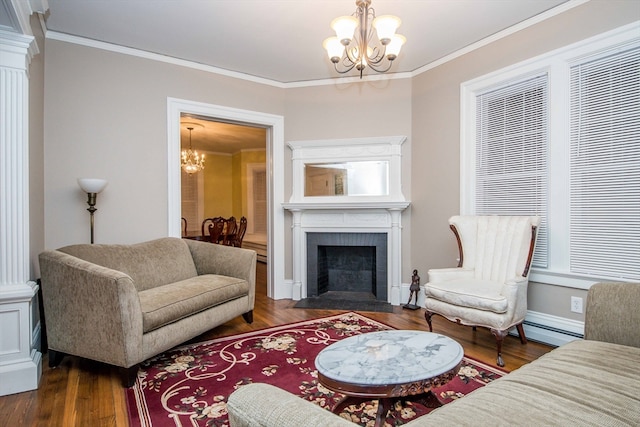 living room with crown molding, dark wood-type flooring, and an inviting chandelier