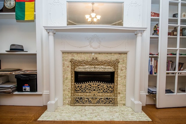 room details featuring hardwood / wood-style floors and a notable chandelier