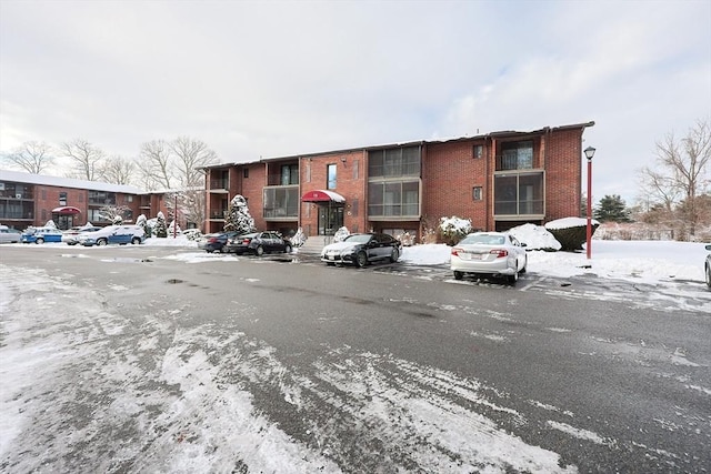 view of snow covered parking