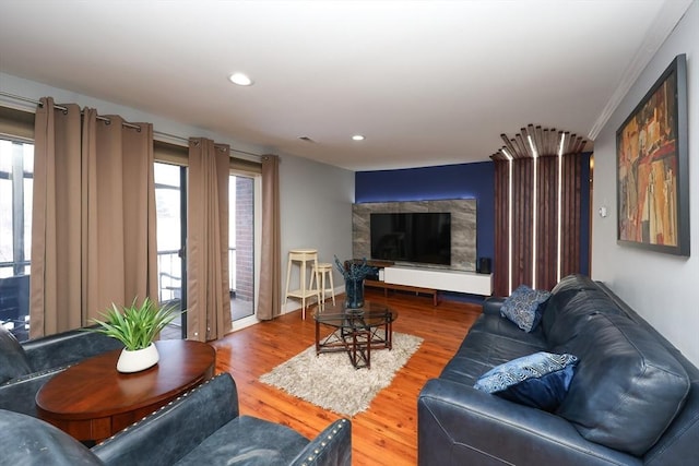 living room with a healthy amount of sunlight and hardwood / wood-style floors