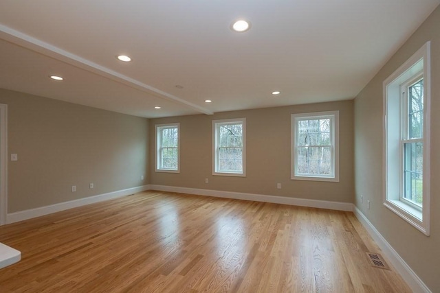 empty room with visible vents, recessed lighting, light wood-style floors, and baseboards