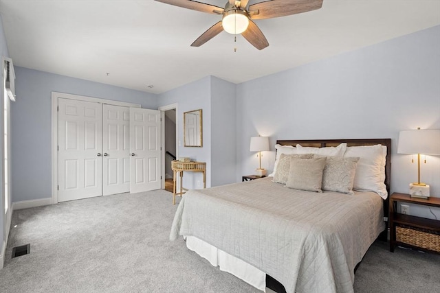 bedroom with carpet, a closet, ceiling fan, and baseboards