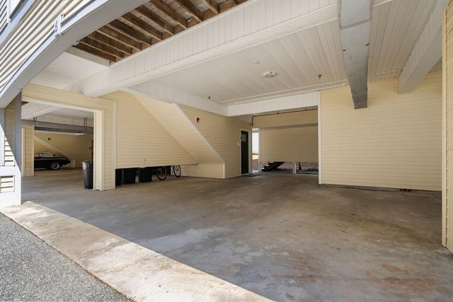 garage featuring an attached carport