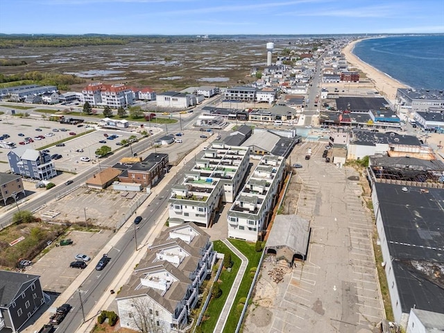 aerial view of property and surrounding area with a large body of water