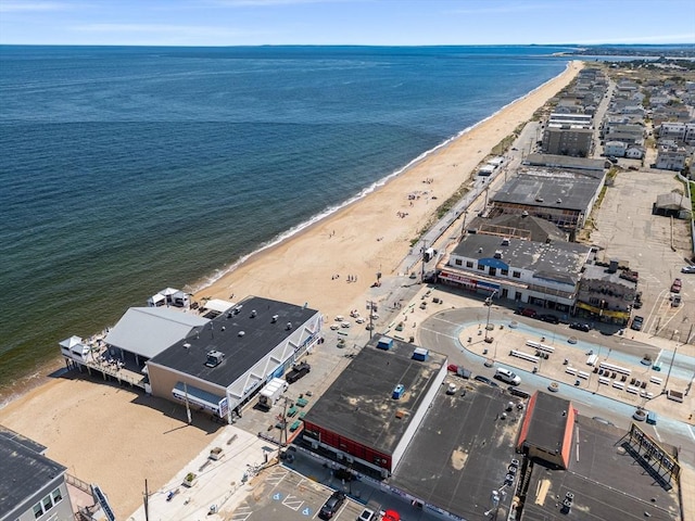 aerial view of property and surrounding area featuring unending shoreline