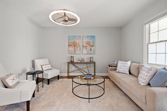 living room with baseboards and wood finished floors