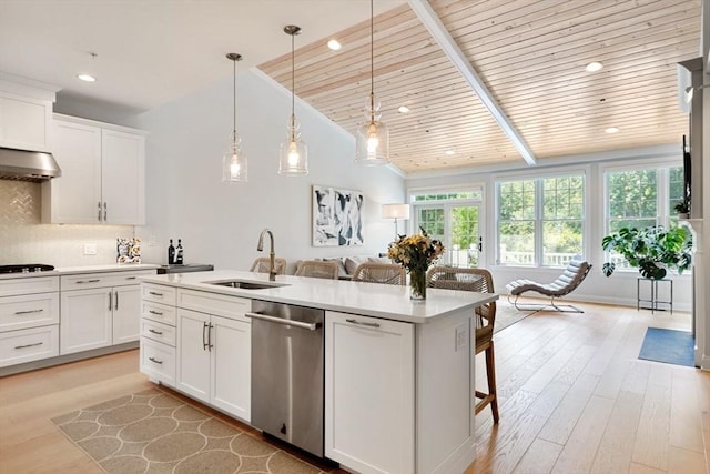 kitchen with dishwasher, sink, and white cabinets