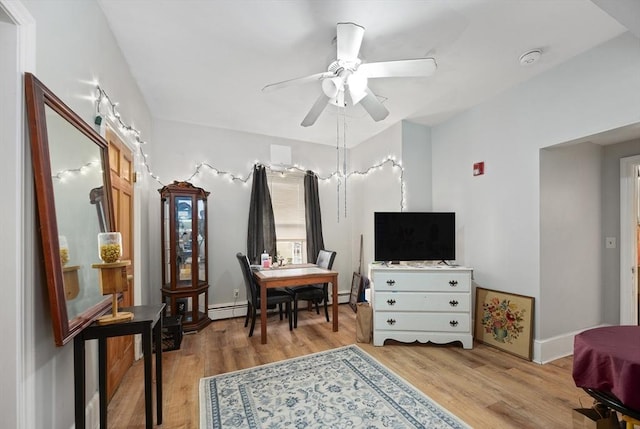 186 Summit St, Pawtucket, RI 02860 - bedroom featuring light wood-style flooring, baseboards, a baseboard heating unit, and a ceiling fan