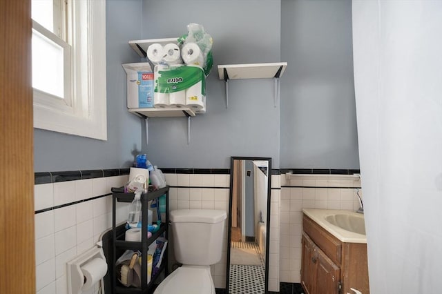 186 Summit St, Pawtucket, RI 02860 - half bathroom featuring tile walls, toilet, vanity, and wainscoting