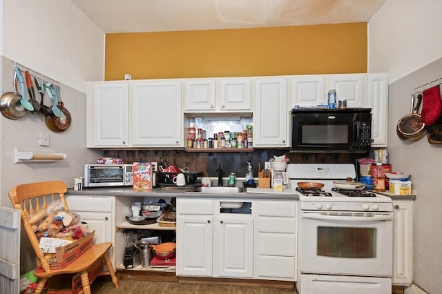 186 Summit St, Pawtucket, RI 02860 - kitchen with black microwave, white range with gas stovetop, a sink, white cabinets, and open shelves