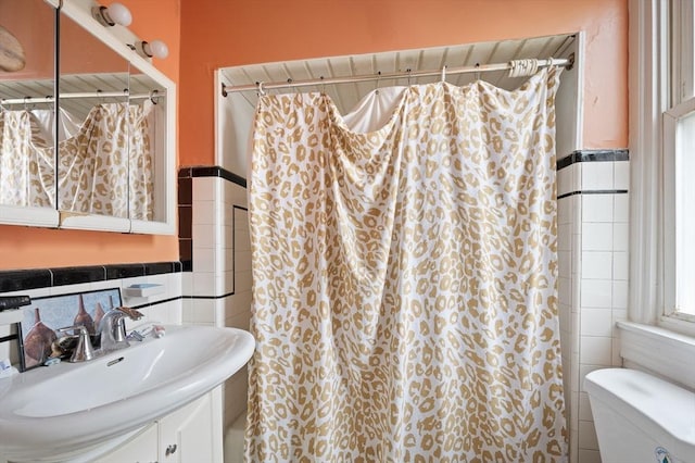 186 Summit St, Pawtucket, RI 02860 - bathroom with tile walls, toilet, vanity, and curtained shower