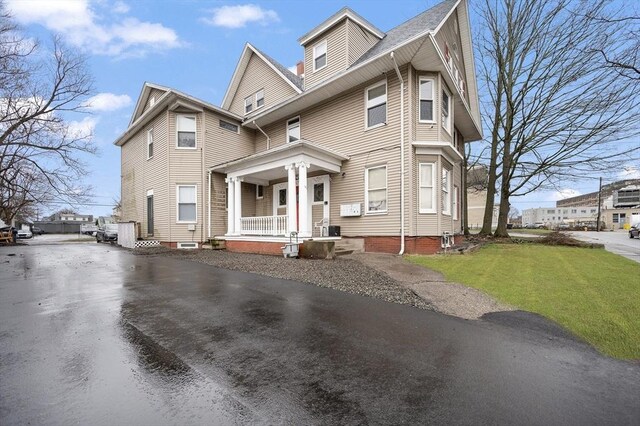 186 Summit St, Pawtucket, RI 02860 - view of front of home with a porch and a front yard