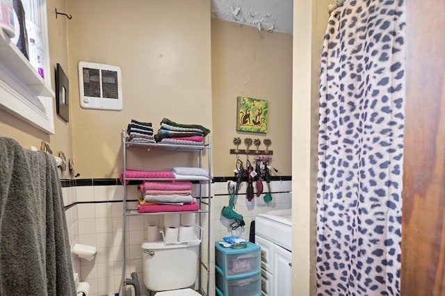 186 Summit St, Pawtucket, RI 02860 - bathroom featuring toilet, tile walls, a wainscoted wall, vanity, and a shower with shower curtain