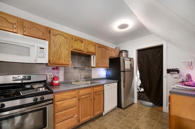 186 Summit St, Pawtucket, RI 02860 - kitchen with stainless steel appliances, a sink, vaulted ceiling, and brown cabinetry