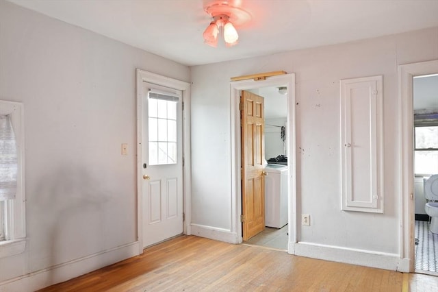 186 Summit St, Pawtucket, RI 02860 - entryway featuring light wood finished floors, washer / clothes dryer, baseboards, and a ceiling fan