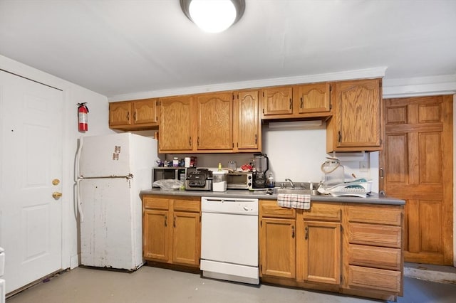 186 Summit St, Pawtucket, RI 02860 - kitchen with white appliances, finished concrete flooring, a sink, and brown cabinetry