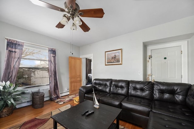 186 Summit St, Pawtucket, RI 02860 - living room with a ceiling fan, light wood finished floors, and a baseboard radiator