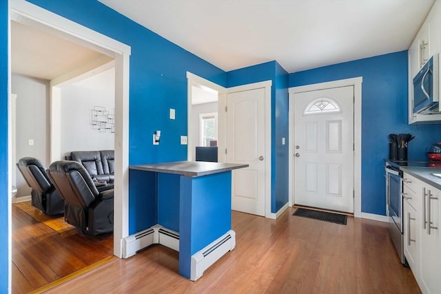 12 Cross St, Pepperell, MA 01463 - foyer with wood finished floors, a baseboard radiator, and baseboards