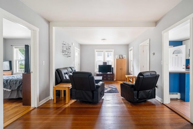 12 Cross St, Pepperell, MA 01463 - living room featuring baseboard heating, hardwood / wood-style flooring, and baseboards