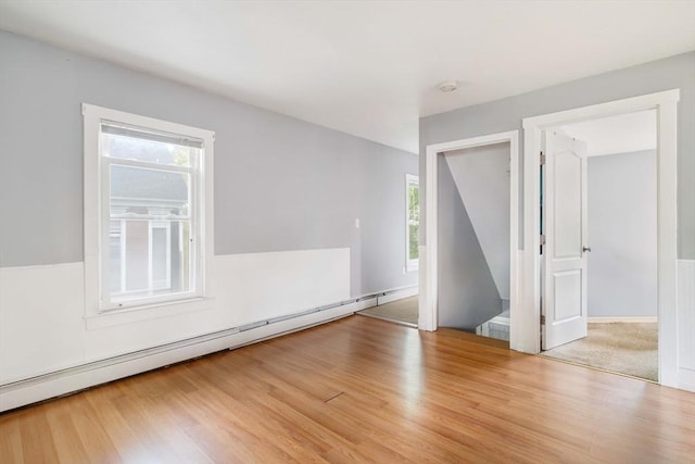 12 Cross St, Pepperell, MA 01463 - spare room featuring a baseboard radiator and wood finished floors