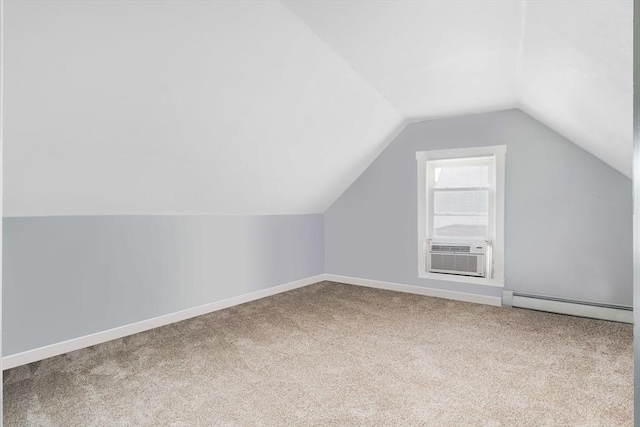 12 Cross St, Pepperell, MA 01463 - additional living space featuring baseboard heating, cooling unit, vaulted ceiling, carpet, and baseboards