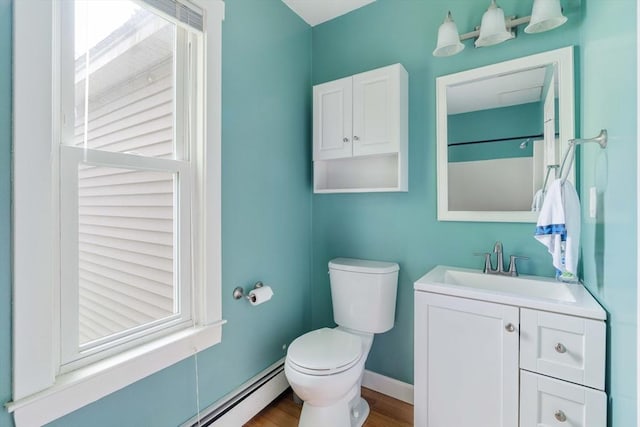 12 Cross St, Pepperell, MA 01463 - full bathroom with vanity, toilet, wood finished floors, baseboards, and baseboard heating