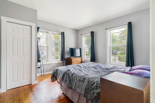 12 Cross St, Pepperell, MA 01463 - bedroom featuring wood-type flooring, a closet, and baseboards