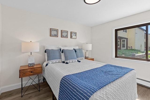 29 Adams Ct Unit 29, Amesbury, MA 01913 - bedroom with wood finished floors, baseboards, and baseboard heating