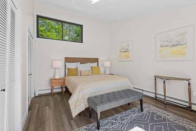 29 Adams Ct Unit 29, Amesbury, MA 01913 - bedroom with a baseboard heating unit, wood finished floors, and baseboards