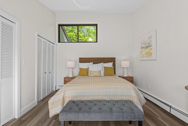 29 Adams Ct Unit 29, Amesbury, MA 01913 - bedroom with a baseboard radiator, wood finished floors, and baseboards