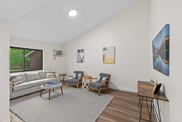 29 Adams Ct Unit 29, Amesbury, MA 01913 - living area featuring vaulted ceiling, wood finished floors, baseboards, and a wall mounted air conditioner