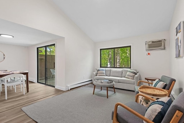 29 Adams Ct Unit 29, Amesbury, MA 01913 - living room featuring a baseboard heating unit, lofted ceiling, wood finished floors, baseboards, and a wall mounted AC