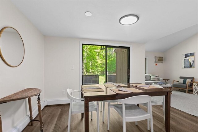 29 Adams Ct Unit 29, Amesbury, MA 01913 - dining space with wood finished floors, baseboards, lofted ceiling, and a wall mounted AC