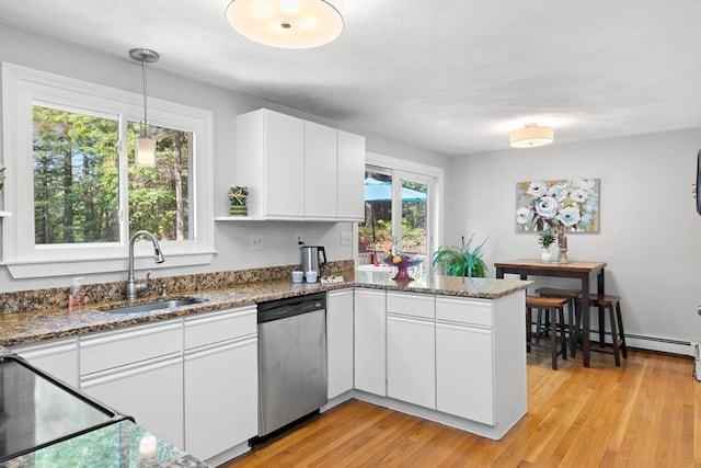1005 Forest St, North Andover, MA 01845 - kitchen featuring dishwasher, a sink, a peninsula, stone countertops, and white cabinetry