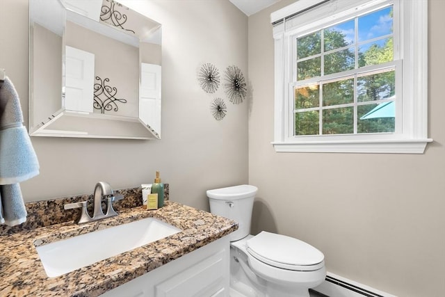1005 Forest St, North Andover, MA 01845 - bathroom featuring toilet, a baseboard heating unit, and vanity