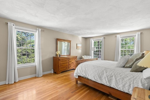 1005 Forest St, North Andover, MA 01845 - bedroom featuring light wood-style flooring and baseboards