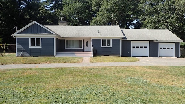 single story home featuring a front yard and a garage