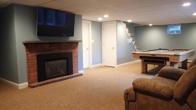 interior space featuring a fireplace, light colored carpet, and billiards