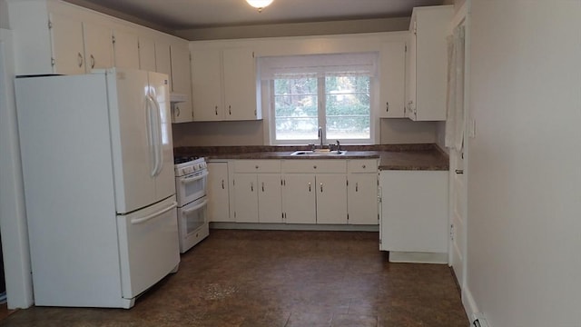 kitchen featuring sink, white appliances, and white cabinetry