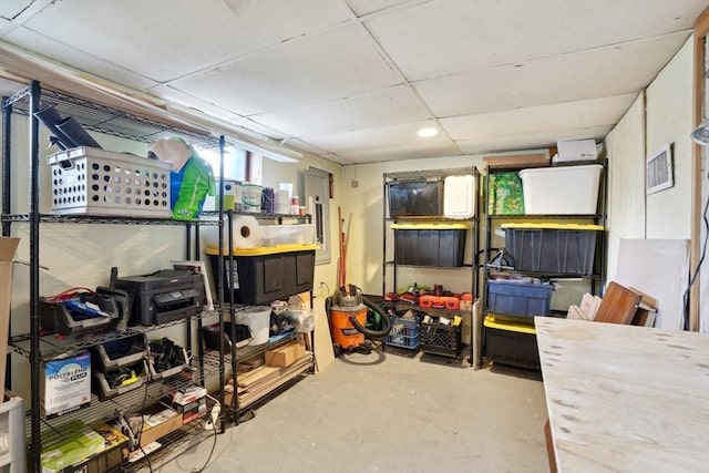 storage room with electric panel and visible vents