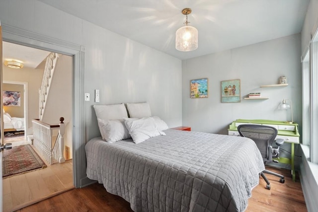 bedroom with wood finished floors