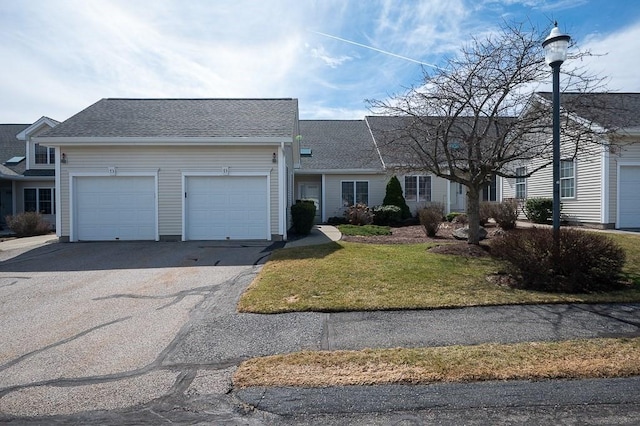 75 Orchard Meadow Dr Unit 75, Shrewsbury, MA 01545 - view of front of property featuring driveway, a front lawn, a garage, and roof with shingles
