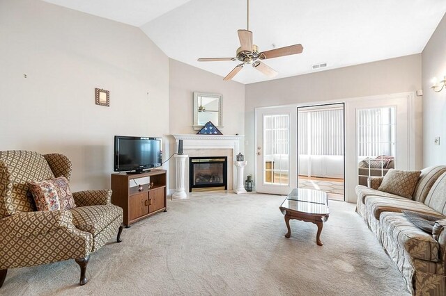 75 Orchard Meadow Dr Unit 75, Shrewsbury, MA 01545 - living area with visible vents, ceiling fan, light colored carpet, vaulted ceiling, and a glass covered fireplace
